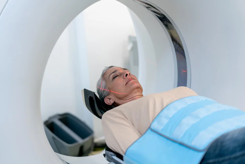 mature woman undergoes CT scan
