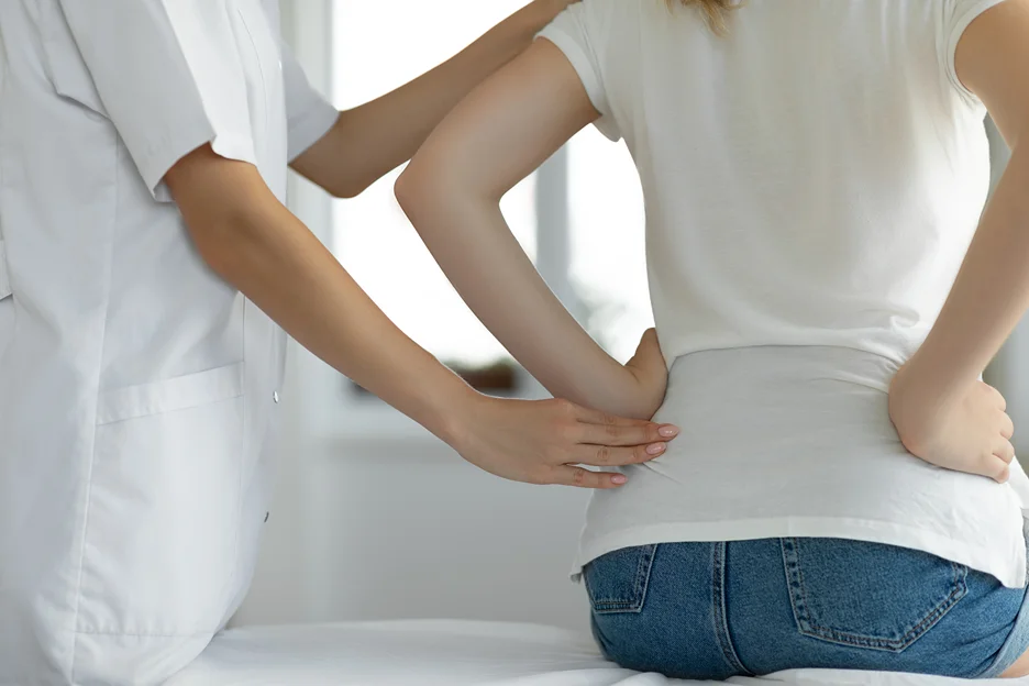 doctor and patient consult on back pain during period