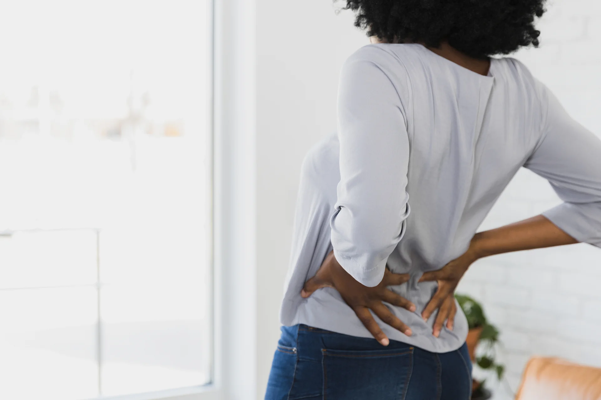 a woman suffering from sciatica pain
